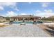 Beautiful backyard pool area with stone features and stylish outdoor furniture seating at 3955 W Jo Rae Ave, Las Vegas, NV 89141