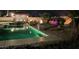 Inviting pool area with decorative fire features and lush landscaping at 3955 W Jo Rae Ave, Las Vegas, NV 89141