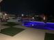 Inviting pool with lush landscaping, artistic fires and night views of the city at 3955 W Jo Rae Ave, Las Vegas, NV 89141