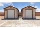 Exterior view of two storage sheds featuring neutral paint and garage doors at 3955 W Jo Rae Ave, Las Vegas, NV 89141