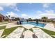 Relaxing swimming pool with surrounding lounge chairs and landscaping offers a peaceful outdoor retreat at 3955 W Jo Rae Ave, Las Vegas, NV 89141