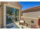 Charming balcony area with seating and a view through sliding glass doors at 4037 Vulcan St, Las Vegas, NV 89122