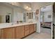 Stylish bathroom featuring a double vanity and a view into the main bedroom at 4037 Vulcan St, Las Vegas, NV 89122