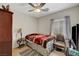 Inviting bedroom showcasing a bed, traditional furnishings, and a ceiling fan at 4037 Vulcan St, Las Vegas, NV 89122