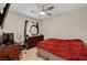 Bedroom featuring a full-size bed, wooden dresser, and an ambient ceiling fan at 4037 Vulcan St, Las Vegas, NV 89122