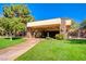Exterior view of the building entrance with a well-manicured lawn and stone facade at 4037 Vulcan St, Las Vegas, NV 89122
