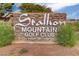 Stallion Mountain Golf Club welcomes visitors with its stone sign, evoking a sense of community and prestige at 4037 Vulcan St, Las Vegas, NV 89122