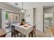 Dining area with sliding glass doors leading to outdoor patio and laundry access at 4037 Vulcan St, Las Vegas, NV 89122