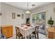 Cozy dining area with tiled floors, natural light, and patio access at 4037 Vulcan St, Las Vegas, NV 89122