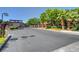 Stone entrance to Stallion Mountain with lush landscaping and secure gate at 4037 Vulcan St, Las Vegas, NV 89122