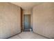 The entryway features a neutral color scheme with a welcome mat and a potted plant at 4037 Vulcan St, Las Vegas, NV 89122