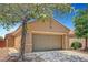 Single-story home showcasing desert landscaping, a two-car garage and covered entry for curb appeal at 4037 Vulcan St, Las Vegas, NV 89122