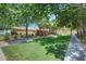 Lush green common area with mature trees and walking paths at 4037 Vulcan St, Las Vegas, NV 89122