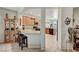 Kitchen with wood cabinets, granite countertops, and breakfast bar at 4037 Vulcan St, Las Vegas, NV 89122