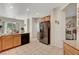 Bright, open kitchen featuring granite countertops, an island with bar seating, and stainless steel appliances at 4037 Vulcan St, Las Vegas, NV 89122