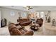 Spacious living room with tile flooring and view to kitchen at 4037 Vulcan St, Las Vegas, NV 89122