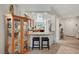 Open-concept living room with tile flooring and view to kitchen at 4037 Vulcan St, Las Vegas, NV 89122