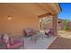 Covered patio area with comfortable outdoor seating at 4037 Vulcan St, Las Vegas, NV 89122