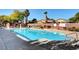 Community pool with lounge chairs and covered patio area at 4037 Vulcan St, Las Vegas, NV 89122