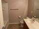 Neutral bathroom featuring a shower-tub combo, vanity with sink, and ceramic tile floors at 4121 Erinbird Ave, North Las Vegas, NV 89084