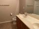 Neutral bathroom featuring a vanity with double sinks, toilet, and neutral wall paint at 4121 Erinbird Ave, North Las Vegas, NV 89084