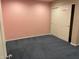 Bedroom featuring plush carpet, pink walls, and a closet with sliding doors at 4121 Erinbird Ave, North Las Vegas, NV 89084