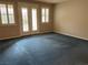 Well-lit living room with french doors, windows, carpet and plantation shutters that let in plenty of light at 4121 Erinbird Ave, North Las Vegas, NV 89084