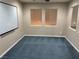 Cozy living room with two windows, plush carpeting and plenty of space for activities at 4121 Erinbird Ave, North Las Vegas, NV 89084