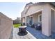 Backyard patio with a fire pit and outdoor seating perfect for entertaining and relaxing outdoors at 4376 Latitude Valley Ct, North Las Vegas, NV 89084