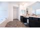 Well-lit bathroom with dual vanities, a soaking tub, and modern finishes at 4376 Latitude Valley Ct, North Las Vegas, NV 89084