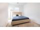 Simple bedroom with carpet, a neutral color palette, a queen size bed and a large window at 4376 Latitude Valley Ct, North Las Vegas, NV 89084