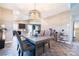 Charming dining room featuring stylish light fixture and modern decor, seamlessly connected to the kitchen at 4376 Latitude Valley Ct, North Las Vegas, NV 89084