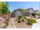Charming home with stone accents, well-manicured landscaping, and a brick driveway at 4376 Latitude Valley Ct, North Las Vegas, NV 89084