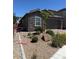 Beautiful single-Gathering home with desert landscaping, stone accents, and a paved driveway at 4376 Latitude Valley Ct, North Las Vegas, NV 89084