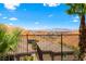 Enjoy the scenic view from this backyard, overlooking rooftops and stunning mountain landscape at 44 Moon Hill Dr, Henderson, NV 89011