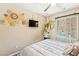Bedroom with woven wall art, indoor hammock, and large window at 44 Moon Hill Dr, Henderson, NV 89011
