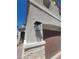 Exterior close-up showcasing a stylish outdoor lantern mounted near the garage entrance at 44 Moon Hill Dr, Henderson, NV 89011