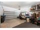 Spacious garage with a golf cart, ample storage, and overhead lighting at 44 Moon Hill Dr, Henderson, NV 89011