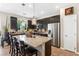 Spacious kitchen with granite counters, stainless steel appliances, large island, and dark cabinets at 44 Moon Hill Dr, Henderson, NV 89011
