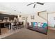 Open-concept living space with stylish sofa and view of the kitchen island at 44 Moon Hill Dr, Henderson, NV 89011