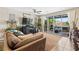 Bright living room featuring a ceiling fan and a sliding glass door to outdoor living at 44 Moon Hill Dr, Henderson, NV 89011