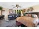 Well-lit main bedroom with a cozy seating area, plush bed, and decorative accents at 44 Moon Hill Dr, Henderson, NV 89011