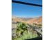Back view overlooking neighborhood, mountains and roads beyond palm trees and rooftops at 44 Moon Hill Dr, Henderson, NV 89011