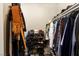 Walk-in closet with custom shelving, hanging racks, and ample storage for clothing and accessories at 44 Moon Hill Dr, Henderson, NV 89011