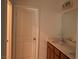 Well lit bathroom features double sinks, a large vanity, and a full sized mirror at 4752 Cactus Sun Ln, North Las Vegas, NV 89031