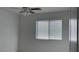 Clean bedroom with a ceiling fan and a window with white blinds at 4752 Cactus Sun Ln, North Las Vegas, NV 89031