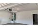 Spacious garage featuring a water heater, door to the inside, and neutral color scheme at 4752 Cactus Sun Ln, North Las Vegas, NV 89031
