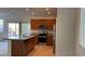 Modern kitchen with granite countertops, stainless steel appliances, and tile flooring at 4752 Cactus Sun Ln, North Las Vegas, NV 89031