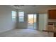 Bright living area with large windows and sliding glass doors to the outdoor patio at 4752 Cactus Sun Ln, North Las Vegas, NV 89031