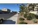Quiet residential street showing well kept homes and landscaping, perfect for peaceful living at 4752 Cactus Sun Ln, North Las Vegas, NV 89031